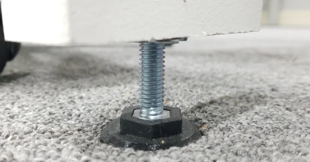 Height adjustment is provided by 3/8" inch bolts and T nuts installed into the bottom of the legs.